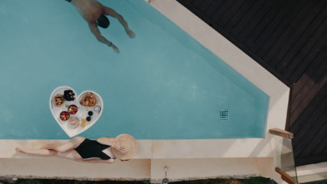 Floating Heart Tray inside a pool with lunch food on the tray